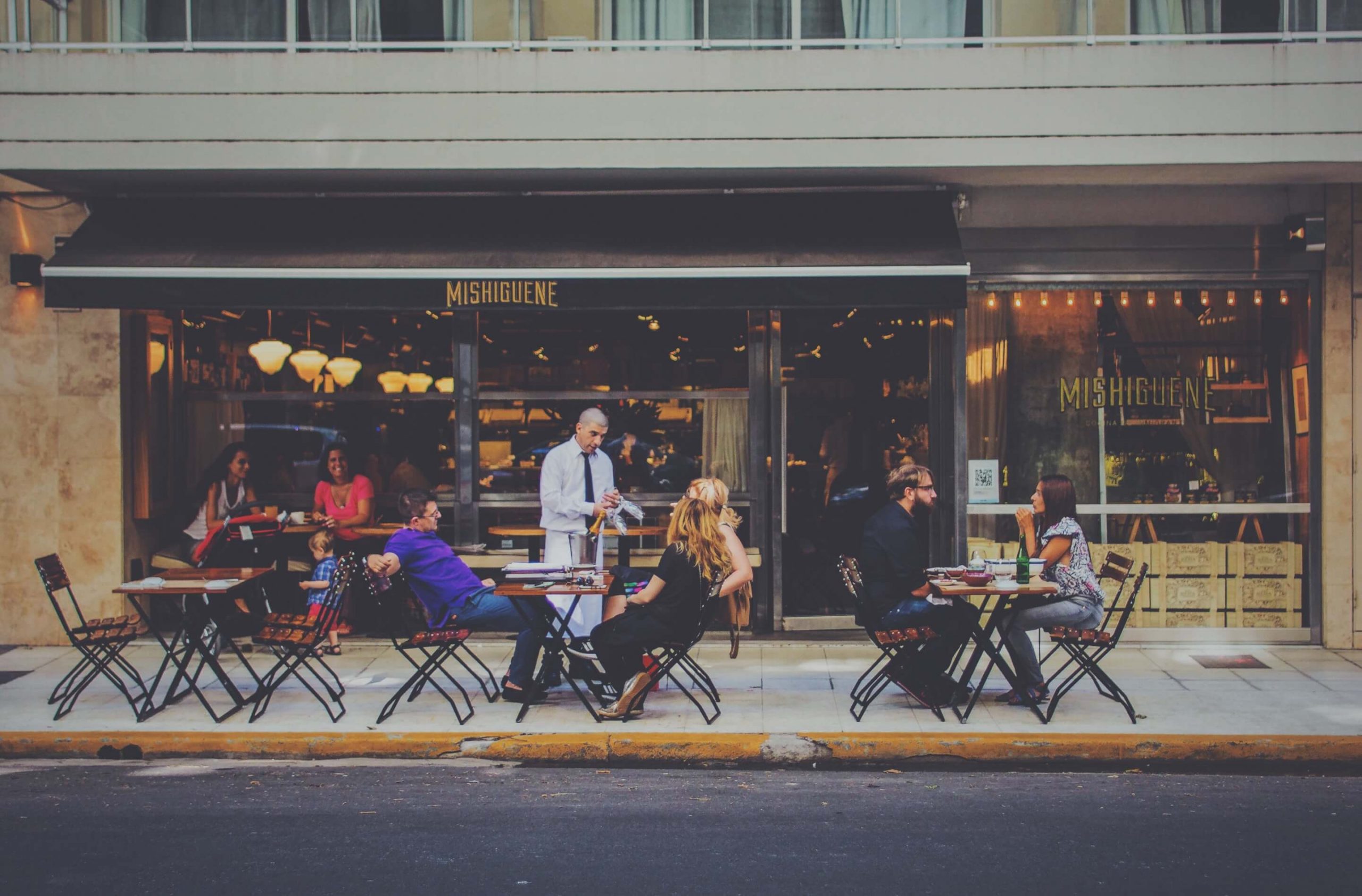 People at Coffee Shop sitting Outside People at Coffee Shop sitting Outside